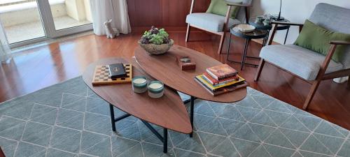 a wooden coffee table in a living room at Barramares Apartment - Sea View Povoa de Varzim in Póvoa de Varzim