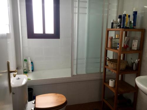 a bathroom with a shower and a toilet and a sink at Dúplex en punta del moral in Isla del Moral