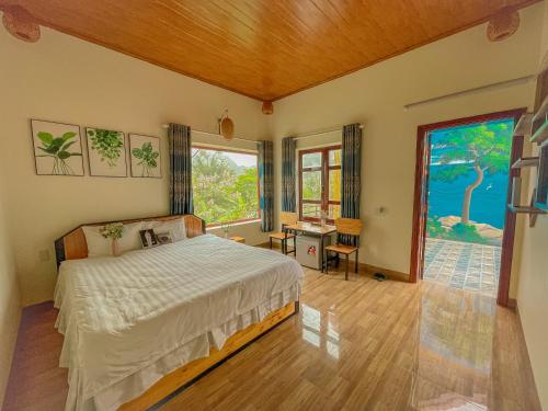 Ένα ή περισσότερα κρεβάτια σε δωμάτιο στο Cosiana Homestay