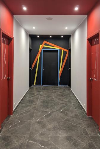 a hallway with a large painting on the wall at Bedcoin Hostel in Hurghada