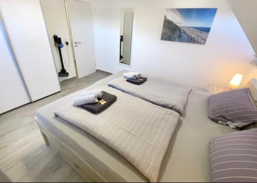 Una cama o camas en una habitación de Robbe 2