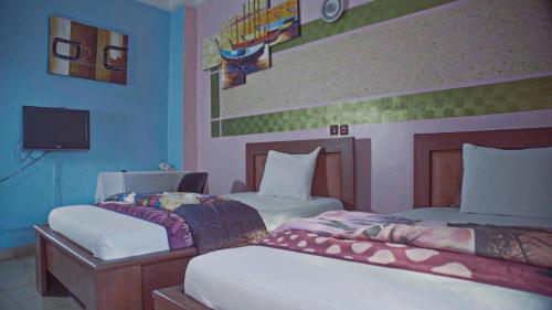 Ein Bett oder Betten in einem Zimmer der Unterkunft HOTEL DE LA VALLEE NEW