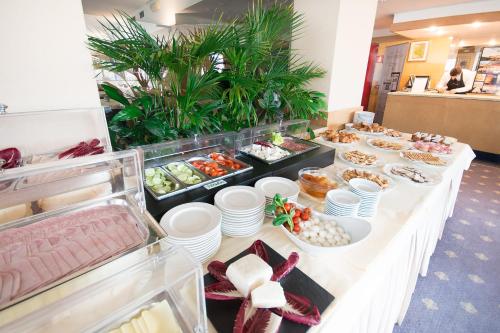 a buffet line with appetizers and food on it at Spazio San Marco in Bergamo