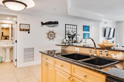 a kitchen with a sink and a counter at Portofino 4-1002 in Pensacola Beach