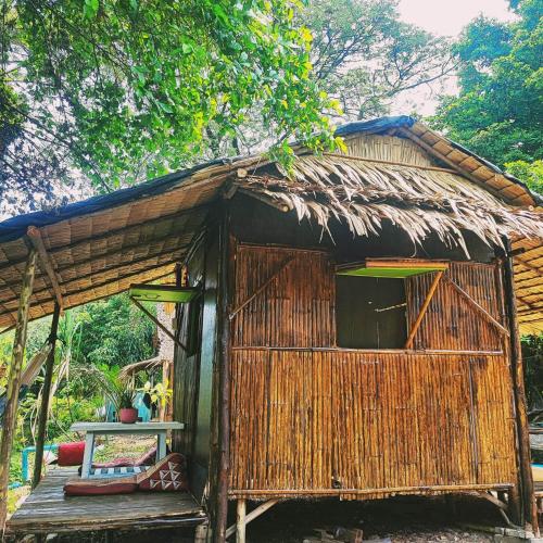 a small hut with a table in front of it at Do Dee cafe in Bangkok