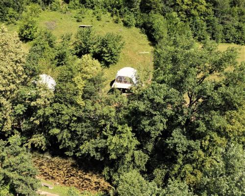 a van parked in the middle of trees at Nomad Glamping in Šipovo