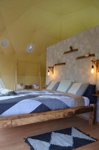 a bedroom with two beds in a tent at Nomad Glamping in Šipovo