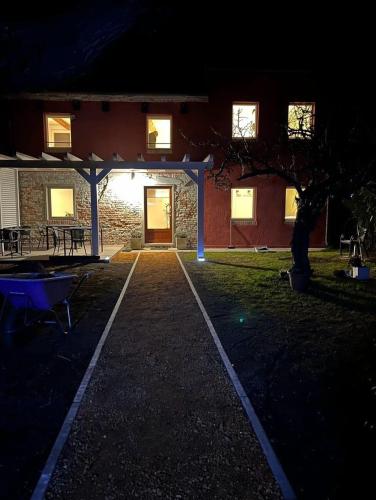 a house with a lit up driveway at night at Agriturismo Basegò in Venice