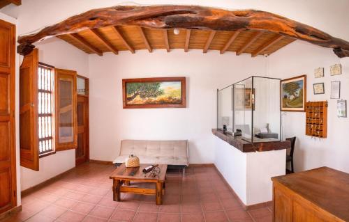 a living room with a couch and a table at Bodega el Huarango in Ica