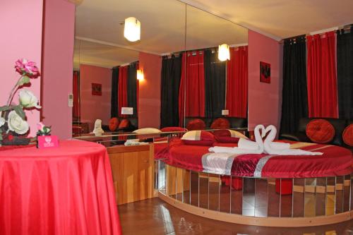 a room with two beds and a mirror at Monte Carlo Love Porto in Porto
