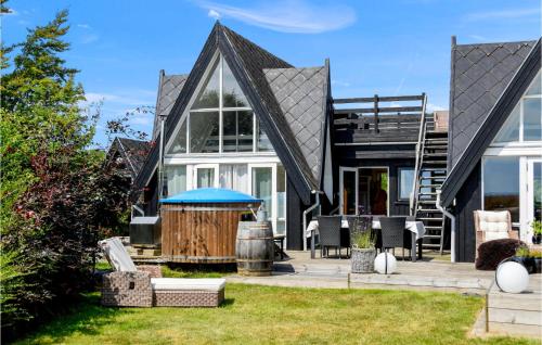 a house with a black roof at Nice Home In Sydals With Wifi in Sønderby