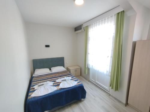 Postel nebo postele na pokoji v ubytování Anadolu Hotel