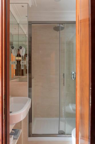 a bathroom with a shower and a sink at Hotel Scalinata Di Spagna in Rome