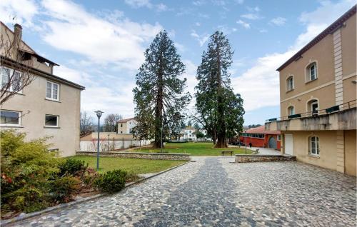 a cobblestone street in front of a building at 2 Bedroom Lovely Home In Bas-En-Basset in Bas-en-Basset