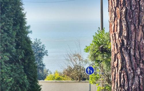 a blue street sign next to a tree at Lovely Home In Meschers-Sur-Gironde in Meschers-sur-Gironde