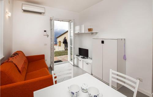 a living room with a couch and a table at Beautiful Apartment In Magliolo in Magliolo