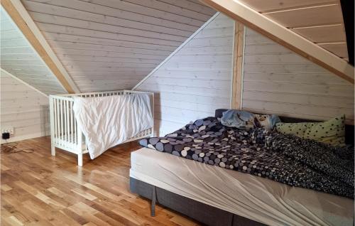 A bed or beds in a room at Pet Friendly Home In Lyngdal With Kitchen