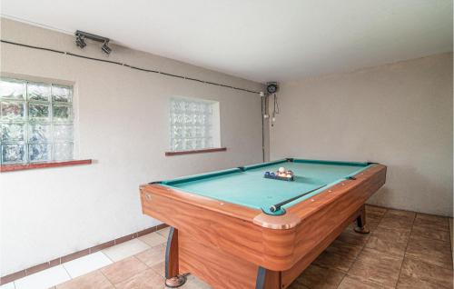 a pool table in the corner of a room at Gorgeous Home In Miciszewice With Wifi in Mściszewice