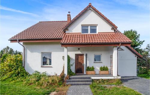 a white house with a red roof at Gorgeous Home In Miciszewice With Wifi in Mściszewice