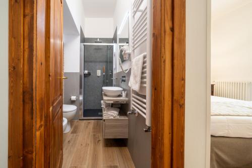 a bathroom with a sink and a toilet in a room at Affittacamere Valentina in Orvieto