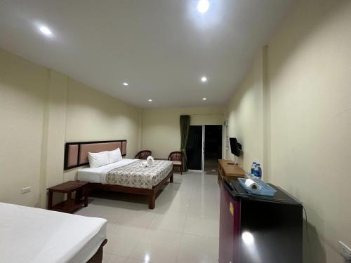 Una cama o camas en una habitación de ไออุ่นรีสอร์ท