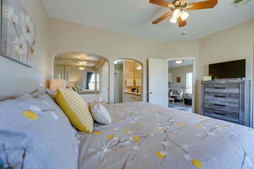 a bedroom with a large bed with yellow pillows at Branson Condo on Golf Course, 4 Mi to Downtown in Branson