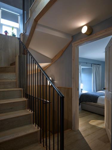 a staircase in a house with a bedroom at Ainster House in Fife
