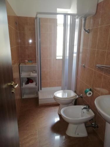a bathroom with a toilet and a sink at B&B Da Rosa Camerota in Camerota
