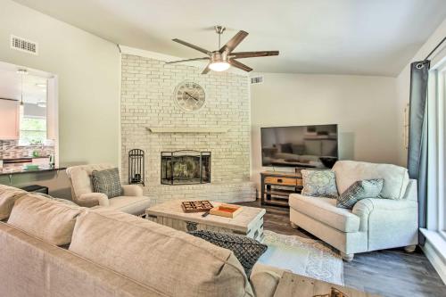 a living room with a couch and a fireplace at about 3 Mi to Dtwn McKinney Suburban Texas Retreat in McKinney