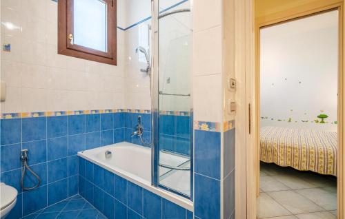 a bathroom with a shower and a tub and a sink at Cozy Home In Forio na With House Sea View in Ischia
