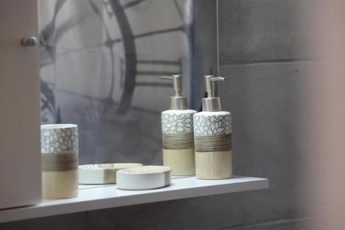 a shelf with four bottles ofodorizers on it at Filoxenia Apartments Corfu Rose in Alepou