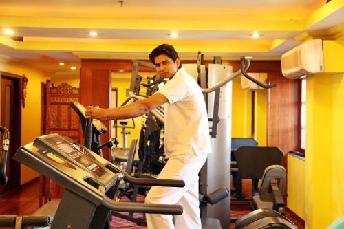 a man on a treadmill in a gym at Regenta Orko's Haridwar, Motichur, 10 min from Har ki Pauri in Haridwār