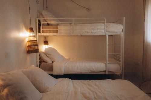 Krevet ili kreveti na sprat u jedinici u okviru objekta Gîtes Chaleureux écoresponsable