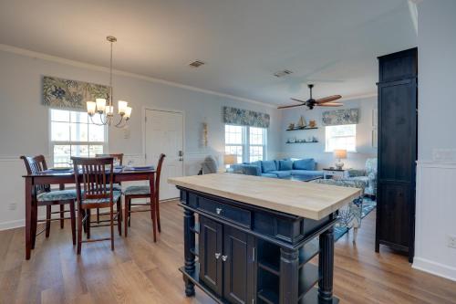 a kitchen and living room with a table and chairs at Fort Myers Home Near Sanibel Island Causeway in Fort Myers