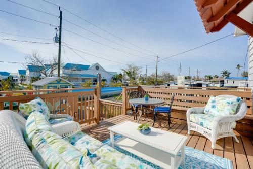 a patio with two couches and a table on a deck at Fort Myers Home Near Sanibel Island Causeway in Fort Myers