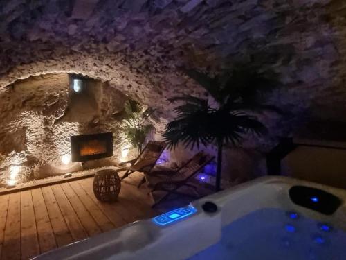 a bathroom with a bath tub in a cave at La voute du pilat in Saint-Chamond