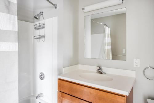 a bathroom with a sink and a mirror at Somerville 1br w wd in building nr Harvard MIT BOS-764 in Cambridge
