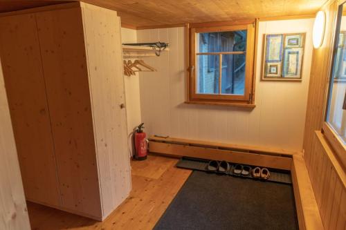 a tiny house with a window and a wooden floor at Ferienwohnung in Schwellbrunn in Schwellbrunn