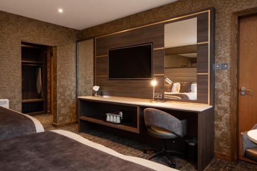 TV a/nebo společenská místnost v ubytování Carlton Hotel