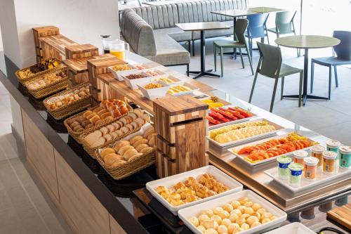 a buffet with many different types of food on display at Sooz Hotel Collection in Sao Paulo