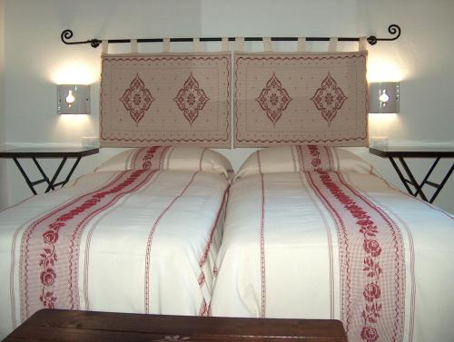 Postel nebo postele na pokoji v ubytování Guest House Il Giardino Segreto