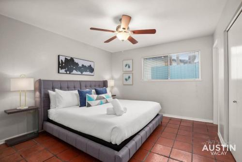 a bedroom with a bed with a ceiling fan at Enjoy Central Austin King Bed Smart TV and AC in Austin