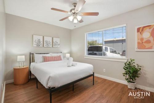 a bedroom with a bed and a ceiling fan at Cook and Gather Around in a Fully Equipped Apartment in Austin