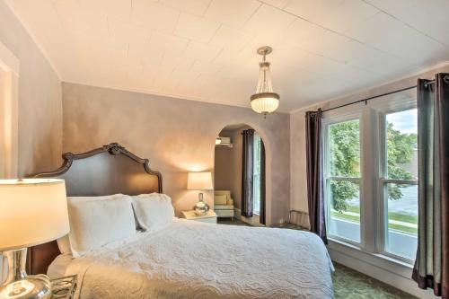 a bedroom with a bed and a large window at Dog-Friendly Home with Balcony and Yard in Surgeon Bay in Sturgeon Bay