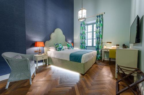 Postel nebo postele na pokoji v ubytování Palazzo Bifora