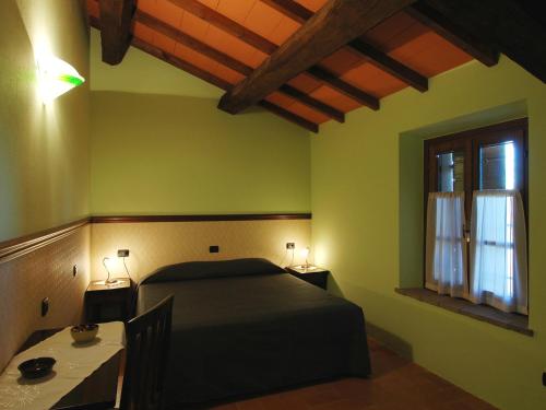 Ліжко або ліжка в номері Antica Grancia Benedettina