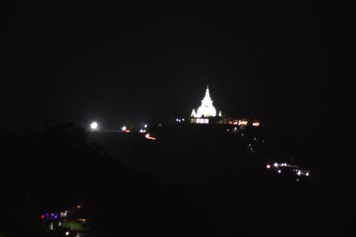 a night time view of a building with lights at Ella Summer Lesser in Ella