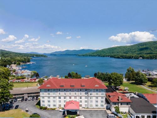 an aerial view of a hotel and a lake at Fort William Henry Hotel in Lake George