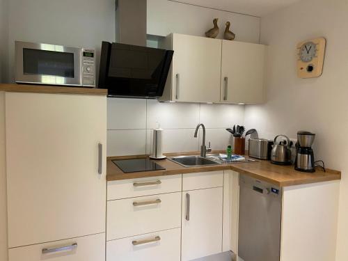 Kleemann´s Apartment****にあるキッチンまたは簡易キッチン