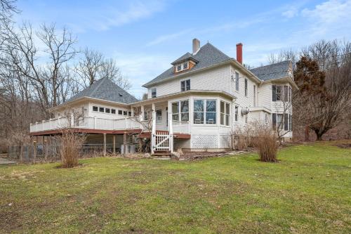 a large white house with a large yard at Stratton Creek Inn in Stratton